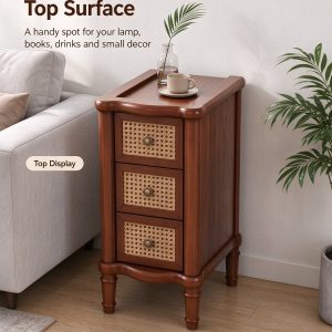 Narrow end table with raised top surface beside a grey sofa